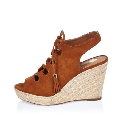 Brown lace-up wedges
